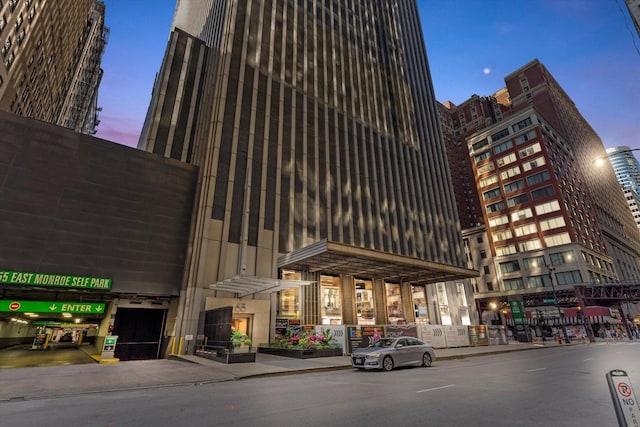 view of outdoor building at dusk