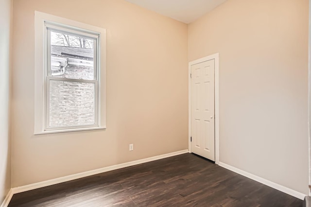 unfurnished room featuring dark hardwood / wood-style flooring