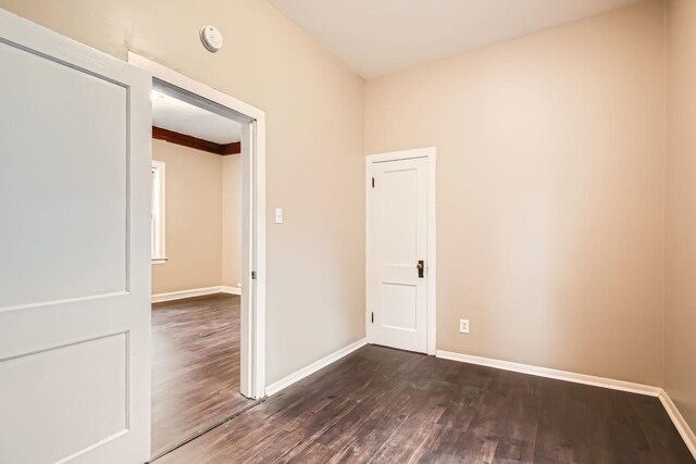 spare room featuring dark hardwood / wood-style floors