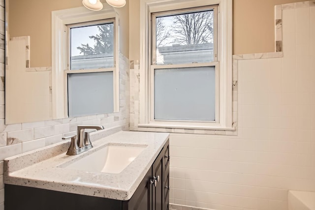 bathroom featuring vanity and a wealth of natural light