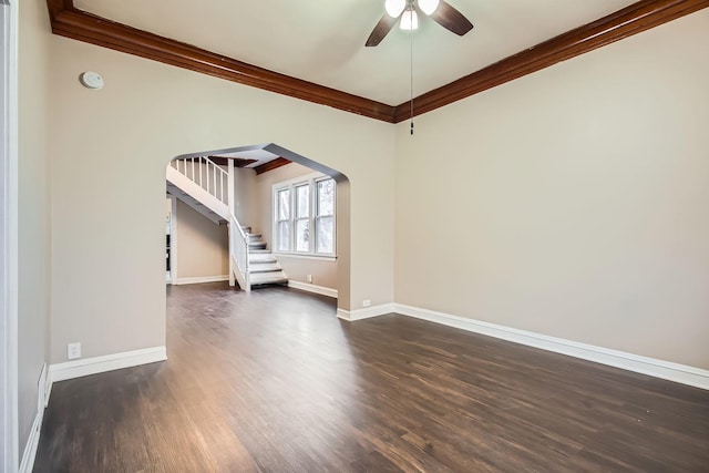 unfurnished room featuring ceiling fan, crown molding, and dark wood-type flooring