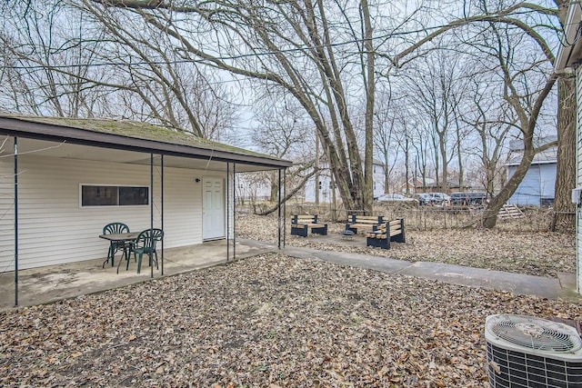 view of yard featuring a patio and central air condition unit