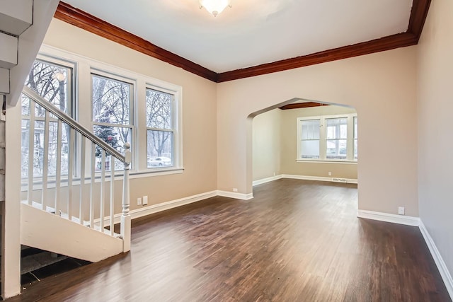 unfurnished living room with crown molding and dark hardwood / wood-style floors