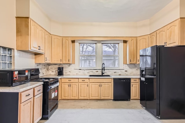 kitchen with decorative backsplash, light brown cabinetry, sink, and black appliances