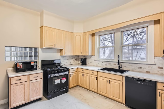 kitchen featuring black appliances, sink, light brown cabinetry, and tasteful backsplash