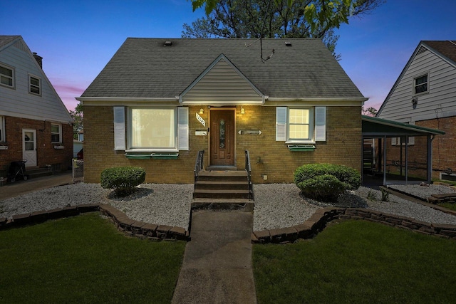 bungalow-style home with a lawn