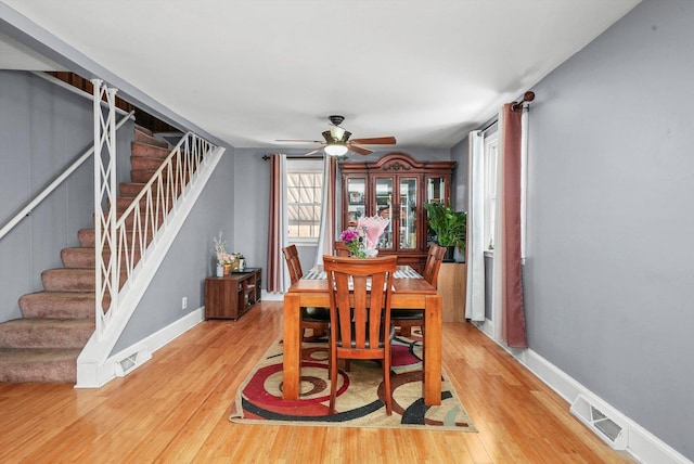 dining room featuring hardwood / wood-style floors and ceiling fan