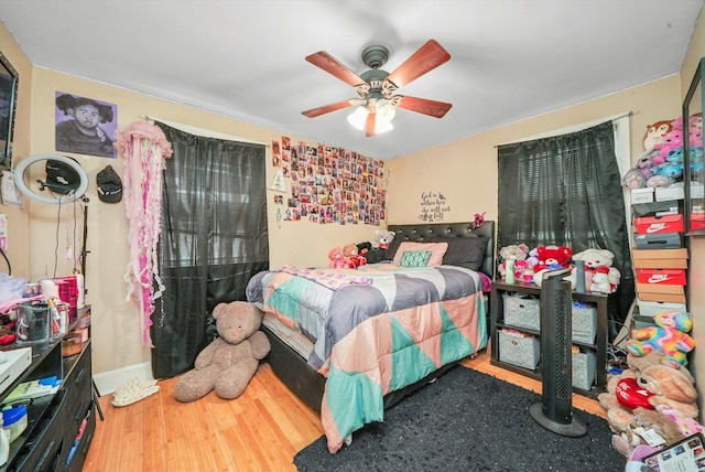 bedroom with hardwood / wood-style flooring and ceiling fan