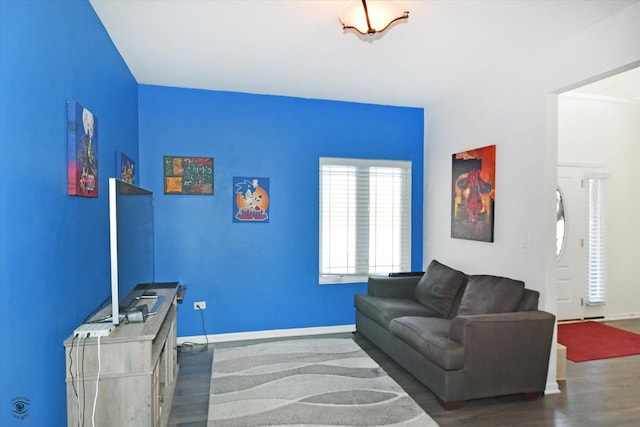 living room featuring baseboards and wood finished floors