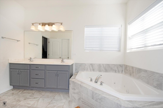 full bath with double vanity, a sink, and a jetted tub