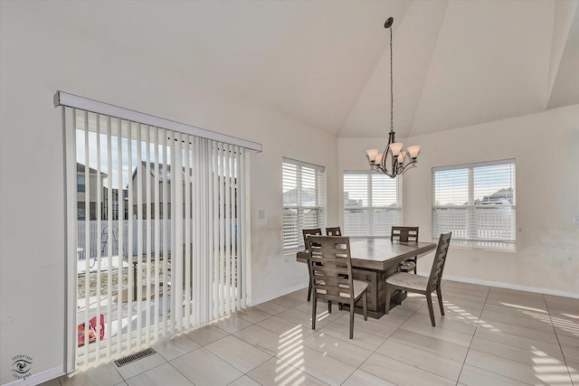 dining area featuring visible vents, a chandelier, baseboards, and light tile patterned flooring