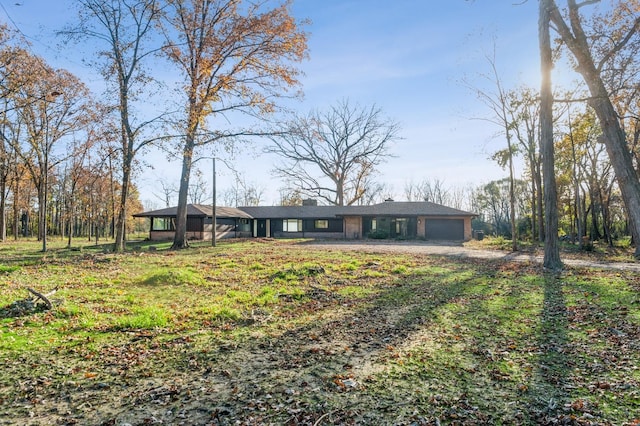 ranch-style home featuring a garage