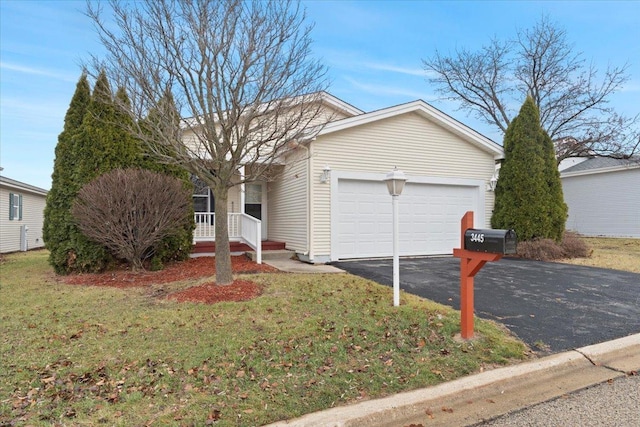 ranch-style house with a front yard and a garage