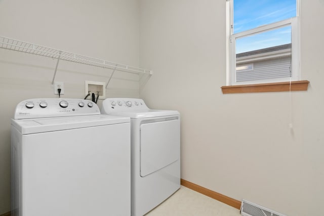 washroom with separate washer and dryer