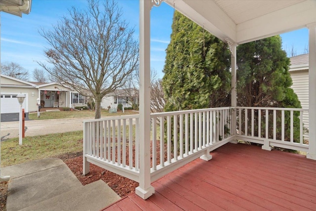 wooden terrace with a porch