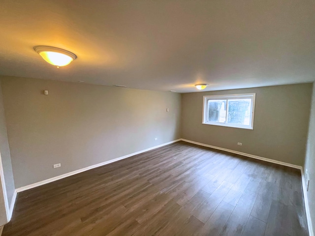 spare room featuring dark hardwood / wood-style floors