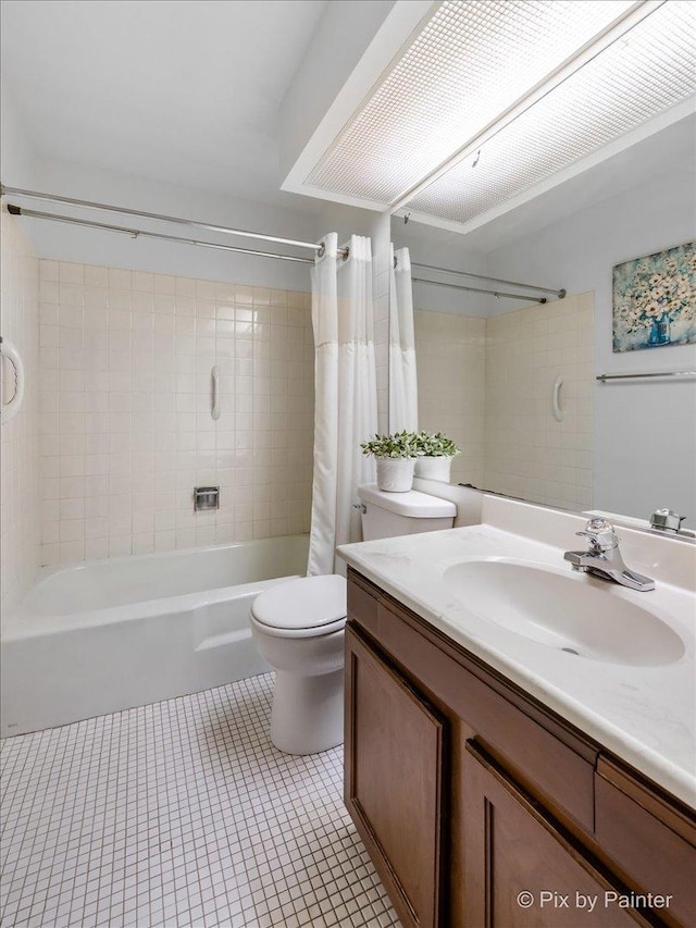 full bathroom with toilet, shower / tub combo, vanity, and tile patterned floors