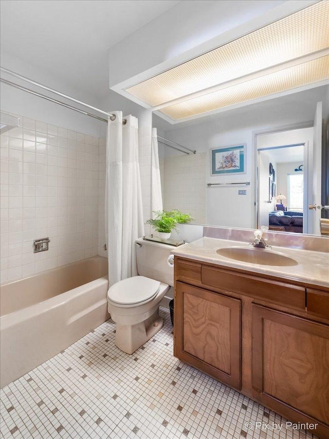 full bathroom with tile patterned flooring, vanity, toilet, and shower / tub combo