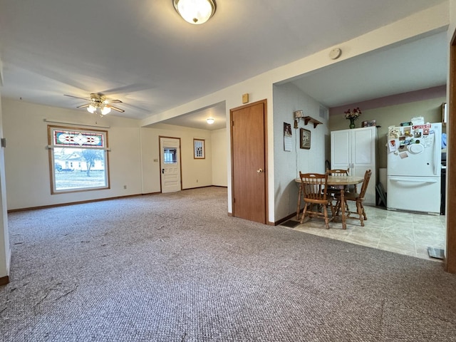 interior space featuring ceiling fan