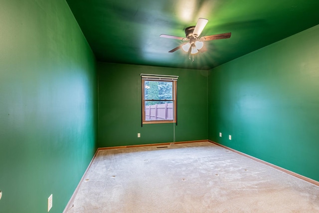 spare room with carpet flooring and ceiling fan