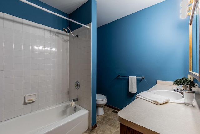 full bathroom with vanity, toilet, and tiled shower / bath combo