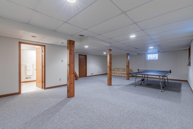 playroom featuring a paneled ceiling and carpet floors