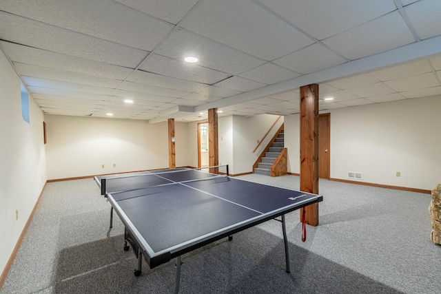 rec room featuring a paneled ceiling and carpet flooring