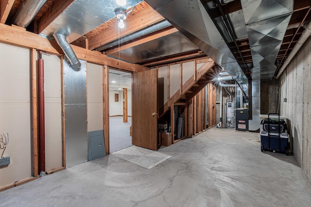 basement featuring heating unit and gas water heater