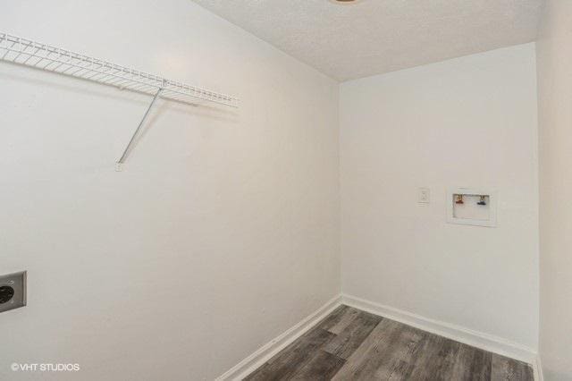 clothes washing area with hookup for an electric dryer, washer hookup, and dark hardwood / wood-style floors