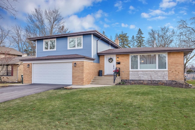 tri-level home with a garage and a front lawn