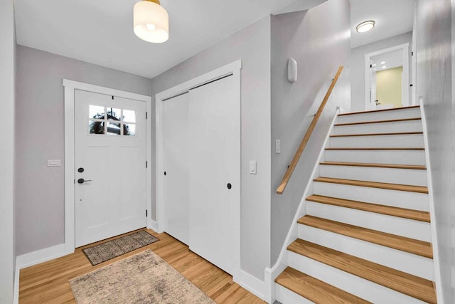 entryway with light hardwood / wood-style floors