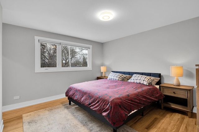 bedroom with hardwood / wood-style flooring