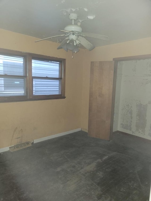 unfurnished room featuring ceiling fan