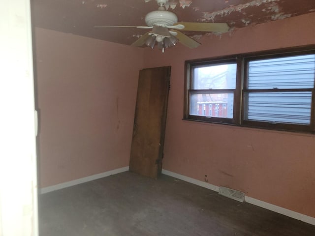 unfurnished room with ceiling fan