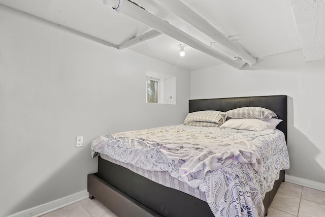 bedroom with tile patterned flooring and baseboards