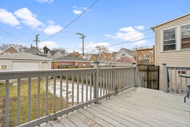 wooden terrace with a residential view and an outdoor structure