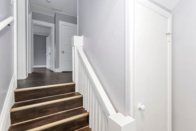 stairs featuring visible vents and wood finished floors