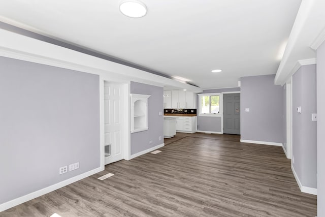 6N772 Tuscola Ave, Saint Charles, IL 60174 - unfurnished living room featuring baseboards and dark wood finished floors