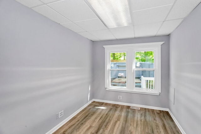 6N772 Tuscola Ave, Saint Charles, IL 60174 - spare room featuring a paneled ceiling, wood finished floors, and baseboards
