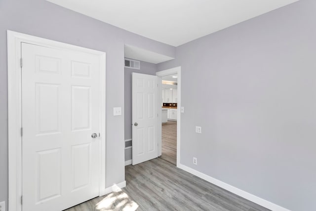 6N772 Tuscola Ave, Saint Charles, IL 60174 - unfurnished bedroom featuring baseboards and wood finished floors