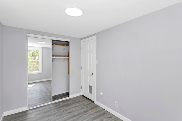 6N772 Tuscola Ave, Saint Charles, IL 60174 - unfurnished bedroom featuring baseboards, wood finished floors, and a closet