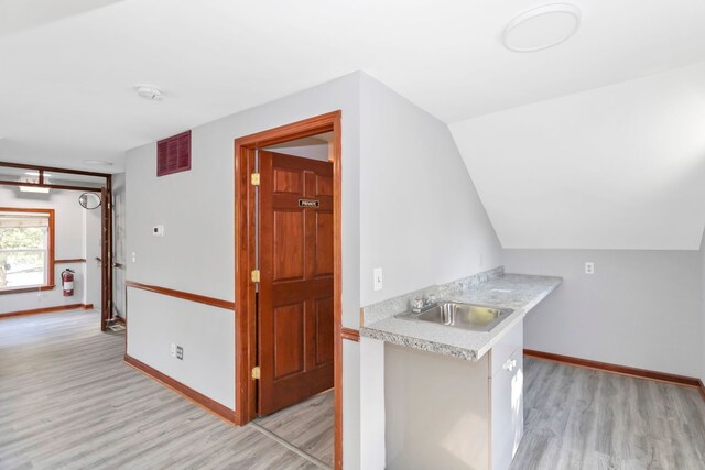 6N772 Tuscola Ave, Saint Charles, IL 60174 - kitchen with a sink, light wood-style floors, light countertops, and baseboards