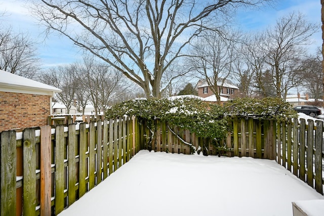 view of yard layered in snow