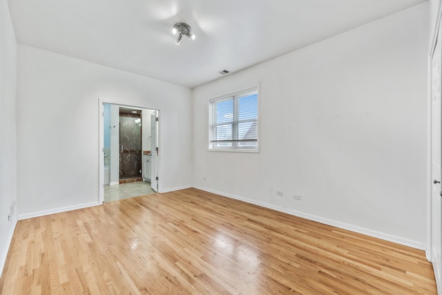 empty room with light wood-type flooring