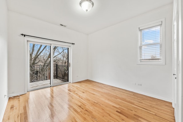 spare room with wood-type flooring