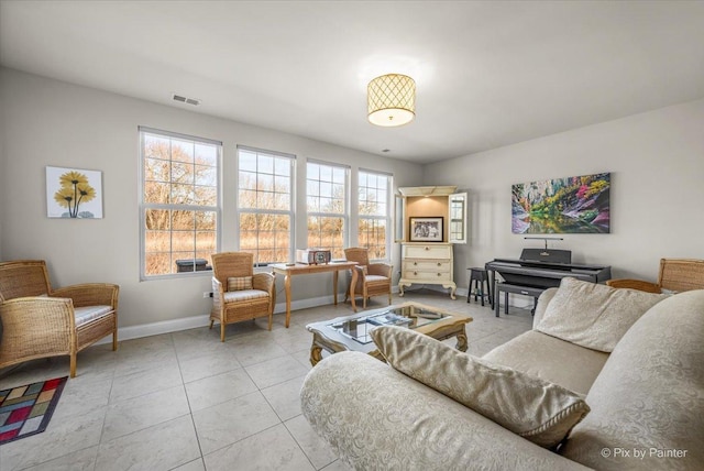 living room with light tile patterned flooring