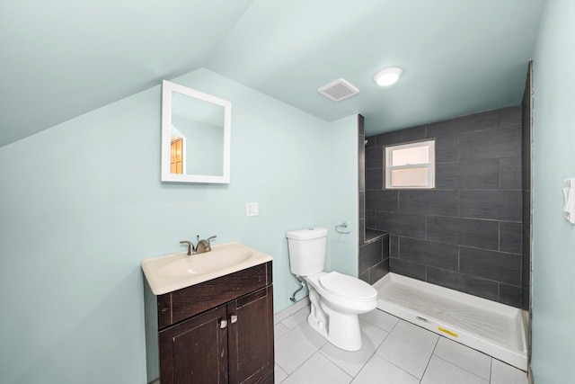 bathroom featuring visible vents, tiled shower, toilet, tile patterned flooring, and vanity