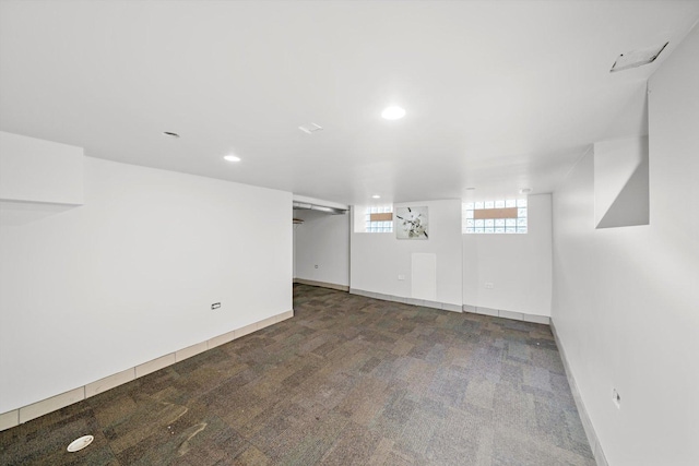 below grade area with carpet floors, recessed lighting, and baseboards