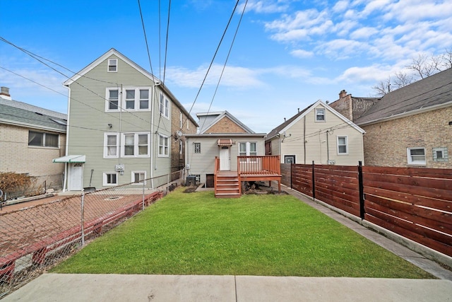 back of property featuring a fenced backyard and a yard