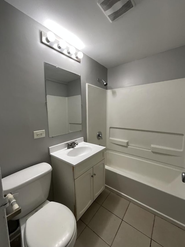 full bathroom with tile patterned floors, vanity,  shower combination, and toilet